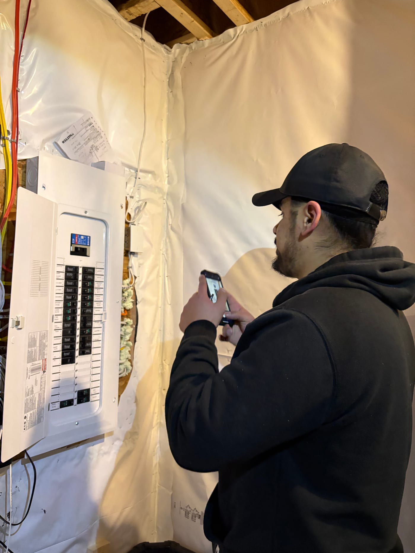Professional home inspector examining electrical systems